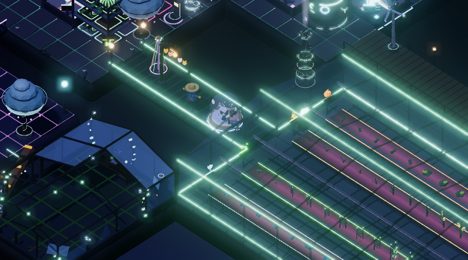 The Grow Hall, a glass greenhouse lit at night